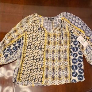 Yellow in blue patterned V-neck shirt